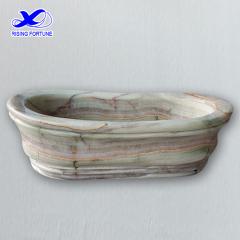 Honed green onyx bathtub